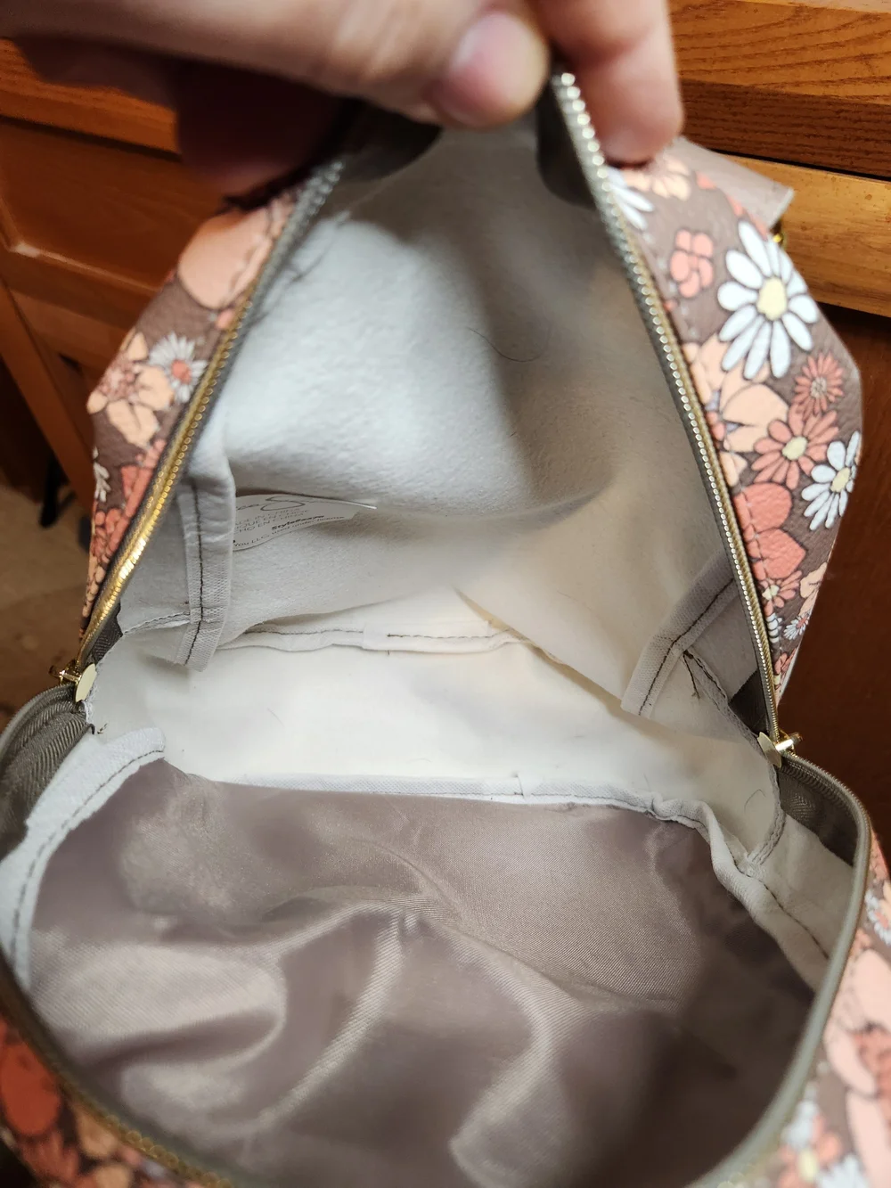Jessica Simpson backpack with butterfly design.